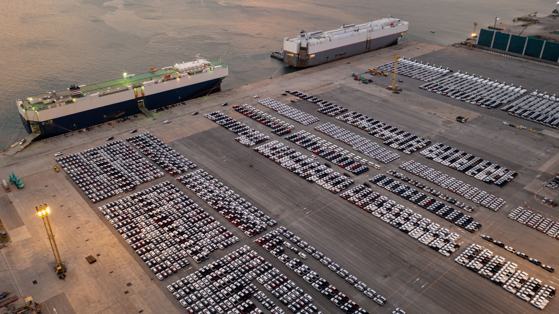 new car products line up in parking lot export for sale aerial view